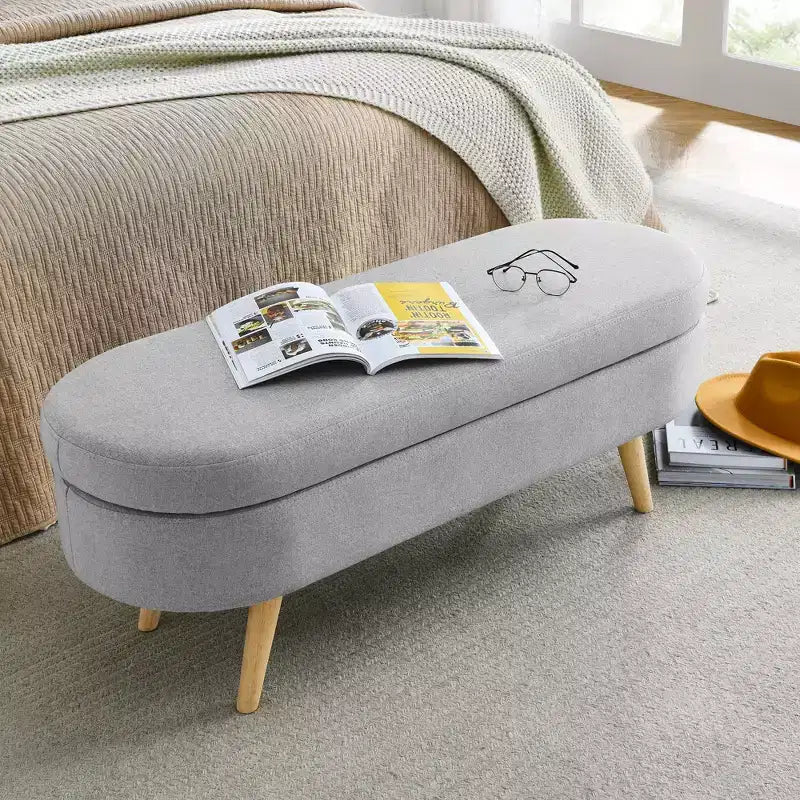 Panca contenitore ovale con gambe in legno di gomma e rivestimento in lino trapuntato – Contenitore nascosto